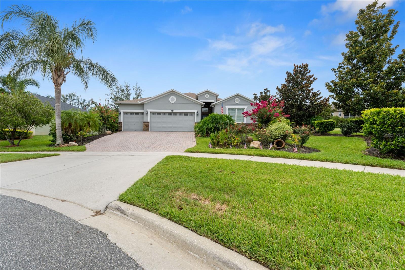 Exquisite POOL home with 3 bedrooms, 3 Bath + Den/Office, a Spacious 3 CAR-GARAGE; peacefully anchored in a cul-de-sac. Located in a premier GATED neighborhood – Legends Country Club, offering privacy and lush amenities. ROOF replaced 2020. AC replaced in 2022. New Pool Heater (May 2025). This modern home boasts clean lines, open-concept living spaces and sleek finishes with thoughtful details for everyday comfort. Timeless PLANTATION SHUTTERS add charm and elegance throughout the home. Stunning kitchen is sure to please with under cabinet lighting, generously sized bar area, sleek quartz countertops, plentiful cabinetry with a seamless flow in the living and dining areas. Sliding glass doors from the family room open to your private oasis, featuring covered outdoor lounge, sparkling SALTWATER POOL and HUGE SPA; with 10 jets, pool heater (gas), all Bluetooth compatible via app (Pentair). Adjacent to the veranda, an additional EXTENDED BBQ space, perfect for year-round entertaining. Legends Country Club Community provides RESORT-STYLE AMENITIES (** HOA DUES INCLUDE, High Speed Internet and TV cable**). The community showcases upscale amenities including GATE / GUARD on duty 24/7, FITNESS CENTER, POOL/SPA, Sauna, On-Site Tavern, Pickleball/Tennis, Playground, basketball courts and a 10,000+ sq. ft. Club house! Home is located in close proximity to Hwy 27, Hwy 50, Florida Turnpike, near Schools, Shops and more. Only 30 Minutes from World-Wide Disney Entertainment, Universal, SeaWorld and Downtown Orlando! Step inside and start your next chapter here – you’ll be glad you did! Call today for a personal tour!