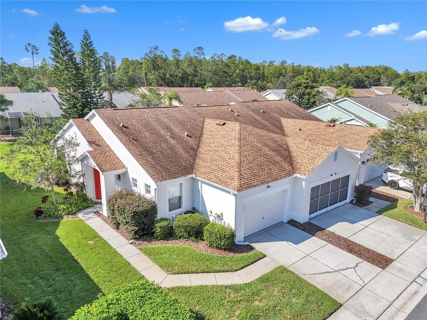 WOW, HUGE PRICE IMPROVEMENT! Live the Resort Lifestyle Every Day in The Groves Golf & Country Club! Welcome to a rare opportunity in one of the most sought-after active 55+ gated communities in Florida—The Groves Golf & Country Club! This beautifully updated 2-bedroom, 2-bath END-UNIT villa with an oversized 1-car garage plus golf cart space is truly move-in ready and designed for carefree Florida living.

Step inside and be greeted by an open, airy floorplan where the spacious kitchen—with sleek stainless-steel appliances—flows seamlessly into the dining and living areas. A screened-in lanai invites you to savor morning coffee or evening sunsets in true Florida style. The split-bedroom design ensures privacy, with a large owner’s suite featuring a charming bay window, walk-in closet, and en-suite bath, while the guest room and full guest bath provide a welcoming retreat for visitors. Enjoy brand-new luxury vinyl plank flooring in the kitchen and baths, plush carpet in living spaces, and plenty of closet storage throughout.
With a newer roof (2023) and low-maintenance living—quarterly HOA fees include lawn care, roof replacement, exterior paint, cable, and internet—you’ll have more time to embrace everything this vibrant community offers.

Community Lifestyle Highlights:
18-hole golf course & driving range
Clubhouse with restaurant, ballroom, fitness center, library, and pro-shop
Resort-style pool & spa
Tennis, pickleball, shuffleboard, bocce courts & dog park
Dozens of clubs and planned activities, making it easy to connect and enjoy every day
Perfectly located near shopping, restaurants, banks, and everyday conveniences, The Groves makes it easy to live a joyful, social, and active lifestyle. Don’t miss this chance to live where every day feels like vacation! Villas in The Groves move quickly—schedule your private showing today before it’s gone!