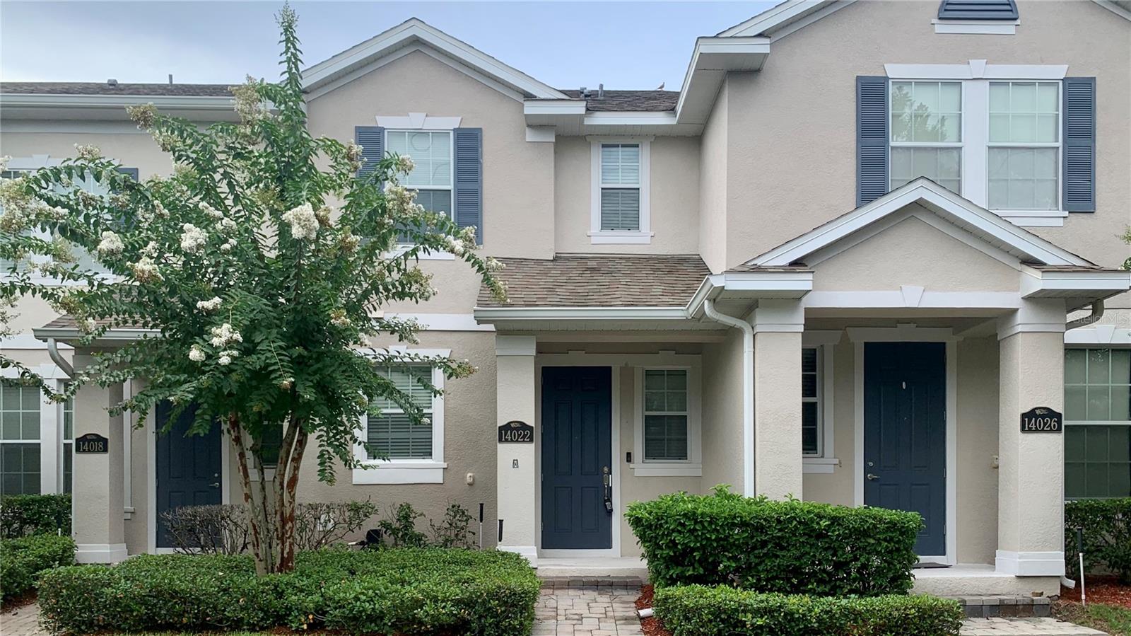 Welcome home to 14022 Avenue of the Groves in Winter Garden! This beautiful 2 bedroom, 2.5 bath two story town home features over 1,300 square feet of living space. Upon entering, you are welcomed into the spacious kitchen overlooking the living area. The kitchen has plenty of natural light and features a full suite of stainless steel appliances including the refrigerator, range, over the range microwave, dishwasher as well as plenty of cabinetry and counter top space. Continuing though the second entrance to the home, there is a covered walkway leading to the garage through the outdoor patio. Both bedrooms are located on the second floor. The primary bedroom is spacious, with private access to the primary bath featuring dual vanities, a standing glass enclosed shower and walk in closet. The second bedroom is well sized, with private access to the second full bath as well, featuring a shower tub combo. Enjoy plenty of amenities included with the HOA, including the community pools, fitness center, walking trails and HOA events. This home is walking distance to the West Orange Trail! Schedule your tour today!