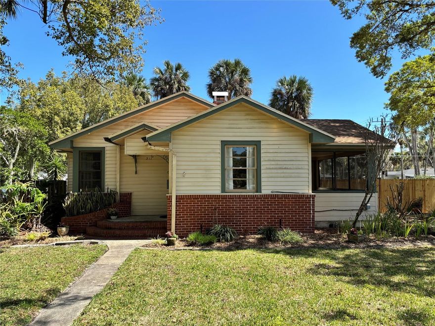 If you're looking for an established neighborhood with trees, character, and community, this is it! Cute 1940's cottage-style home is in the heart of historic Mayfair neighborhood, steps from Lake Monroe, the Riverwalk, and historic downtown Sanford. With three bedrooms and two baths, this home is brimming with charm: original wood floors, original doors and hardware, arched openings, built-in bookcases with storage, fresh paint, garden window in kitchen, and lovely details that don't come with a new build. A separate building behind the home can be used as a light-filled office or studio and has been fully renovated including a mini-split a/c, new flooring, storage cabinet, and mini fridge. An additional portion of the building is a roomy storage area with built-in shelving. New roof installed in 2024. On-demand gas water heater installed in 2022. New deck and fencing just installed. Indoor laundry has stackable washer/gas dryer combo unit which stays with the home. Under home crawl space is outfitted with vapor barrier and pest exclusion. Transferable termite bond and no HOA. Bring your golf cart to enjoy the Sanford lifestyle!