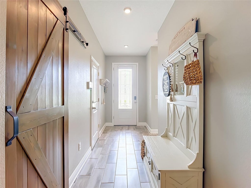 Photo of 813 Old Windsor Way, Spring Hill, FL 34609 (MLS # TB8552446)