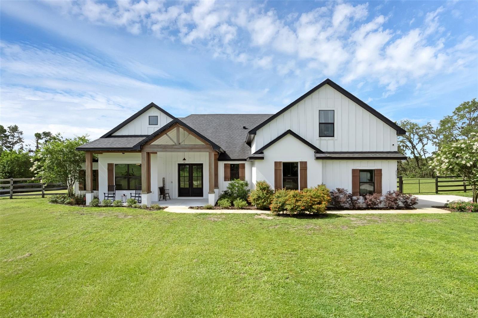 Just reduced and priced to sell! Welcome to your dream farmhouse retreat! Nestled in the serene and highly sought after BEAUCLAIR RANCH CLUB gated community, this stunning custom home sits on 2.4 beautifully landscaped acres and offers the perfect blend of privacy, space, and luxury. Featuring 5 spacious bedrooms and 3.5 bathrooms, this home is thoughtfully designed for both comfort and functionality. Enjoy warm summer days lounging by the sparkling pool, relaxing by your private fire pit, or taking in peaceful views of the pond just beyond your FULLY FENCED backyard —no rear neighbors means uninterrupted tranquility. The expansive grounds provide endless possibilities, whether you’re looking to garden, entertain, or simply soak in the natural surroundings. Inside, you’ll find quality craftsmanship throughout, generous living spaces, and a layout ideal for families or multi-generational living. The primary bedroom offers an oversized ensuite bathroom fully equip with dual sinks, massive shower, free standing tub, and unbelievable walk-in closet. Stepping through the mudroom with custom shelving and storage, you'll head past the open living space to find three more bedrooms, along with a full size bathroom with dual sinks. Just above the garage, you'll find a fifth bedroom that's over 500 square feet - perfect for a future movie or game room, or in law suite. The gated community offers added security and a welcoming sense of community, while the home’s farmhouse charm and modern amenities make it truly one-of-a-kind. Don’t miss this rare opportunity to own a slice of country-style paradise with all the conveniences of upscale living!