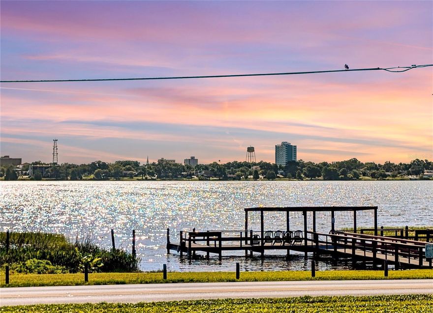 Wake up and start your day with a view and enjoy LAKE LIVING for an affordable price. From your bedroom or FLORIDA ROOM, you’ll look out over the COMMUNITY POOL and beautifully landscaped courtyard, a peaceful way to ease into the morning. Take a short stroll to the COMMUNITY FISHING PIER on Lake Howard and enjoy its scenic views. Located in Building Two, this well-maintained condominium offers a quiet, easygoing lifestyle. Situated on the second floor, this condo offers low-maintenance living, with both ELEVATOR and stair access. Inside, the Great Room is open, bright, and comfortable, perfect for relaxing evenings or time with friends. The dining area flows naturally from the Great Room, making everyday living simple.  The MAIN BEDROOM easily fits a king-sized bed, 2 night stands and room for additional furniture.  The en-suite bathroom features a step-in shower and walk-in closet.  The guest bedroom accommodates a queen size bed and two end tables, ideal for visitors. The kitchen offers ample cabinet space and a convenient pass-through window, keeping everything connected. Sliding glass doors lead to the Florida Room, adding extra living space along with a bonus storage closet. Recent updates include fresh interior paint. LAMINATE AND TILE flooring throughout the condo. You’ll also appreciate the in-unit WASHER, with an additional community laundry room just steps away. The building includes first-floor storage, a third-floor meeting room and assigned covered parking. Enjoy the community pool, fitness area, and the ease of maintenance-free living, with the HOA covering cable, internet, water, sewer, trash, exterior upkeep, and grounds care. FURNISHED OPTIONS are available, making this a true move-in ready or seasonal “lock and leave” opportunity. All of this: lake access, convenience, and a relaxed lifestyle can be yours in this 55+ community. Many restaurants and downtown shopping is just minutes away from Imperial Harbours Community.