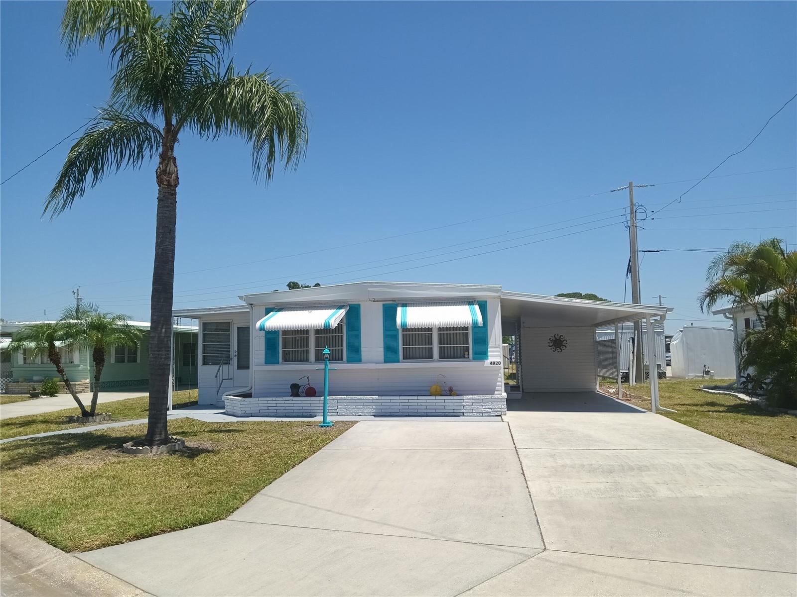 Welcome to Tri-par Estates, our active vibrant 55+ community where neighbors become friends, and every day feels like a vacation. Welcome home to your 2 +2 fully furnished/turnkey piece of paradise, just bring your suitcase! The great floor plan includes a large Florida room, and there are two sheds which provide plenty of extra storage. The roof is new in 2024 and water heater in 2022. This unit comes with two parking spots for your convenience. Each property in Tri-par is individually owned with a deed and title to the home. Enjoy countless amenities, from the Olympic-sized heated pool and relaxing spa to the palapa tiki hut, used for music, dancing and fun gatherings. Stay active with pickleball courts, shuffleboard, mini-putt, and a fully equipped gym. Indulge in creative pursuits with painting and sewing classes or casual entertainment such as ping pong, billiards, and various card games. You own your own land in this special parks and recreation district, and pay no HOA fee directly to the association. The annual association amount of $1,584 is included in your property taxes. Golf cart-friendly community with optional storage for your R/V or boat. With the Sarasota airport just minutes away, it's a perfect location for snowbirds or travelers. Sarasota - a town that feels like paradise, known for its world-class arts, museums, theaters, and alternative wellness offerings. The vibrant downtown, bustling marinas, and UTC shopping mall are all nearby. Best of all, you're just 20 minutes from the stunning beaches that have made Sarasota famous.