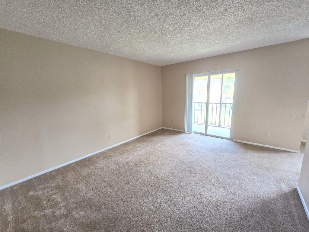 Photo of 9933 Sweepstakes Lane #4, Orlando, FL 32837 (MLS # O6397972)