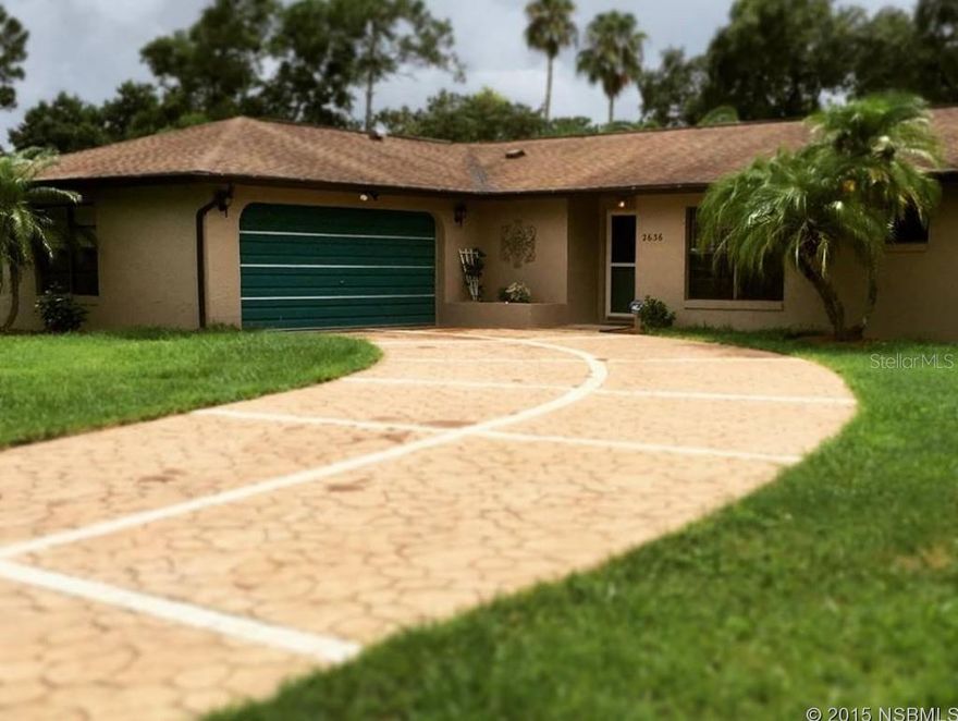 Beautiful Home in New Smyrna Beach. This home sits on just about a Â½ acre lot giving you plenty of room for your Boats/RVâs and any other big boy toys and is fully fenced with an impeccable pad for parking. Main Home is approximately 2166 sq. ft. with Two Owners Suite Split giving each plenty of privacy. Owner Suite 1 with two walk in closets and double doors leading you into a massive Upgraded Bath with Jetted Tub, Walk In Shower and Double Vanity; Water Closet and Linen Closet. Owners Suite 2 gives you complete access to Pool Area with Sliders leading out; Shower and Single New Vanity. Stepping into the Family Room with the Dramatic Cathedral Ceilings and Beams; French Doors leading out to Pool Area from Family Room giving plenty of Cool Afternoon Breezes. Big Family? This Dining Room is capable of seating plenty of your Closest Family and Friends with Breakfast Bar leading you into your Kitchen with a Full Black Appliance Package. After Dinner is complete, move the party to your Wall of Windows in the Florida Room for an evening of relaxing by the Pool and Coye Pond. Guest are tired and it's now time to retire into the Guest House with a Full Kitchen, Full Bath and plenty of room to watch a little TV in your Living Area before retiring to Bed. Guest House also provides a Bright and Airy Office Space for Owners Use or a place for your Guest to do some Quiet Reading (720 sq ft). Side Entry 2 Car Garage (Oversized) and remember, parking pad behind fence for over flow and storage. Work Shop tucked away behind Guest House for the Man of the House to tinker. All measurements deemed to be accurate but cannot be warranted or guaranteed. ;Water: City