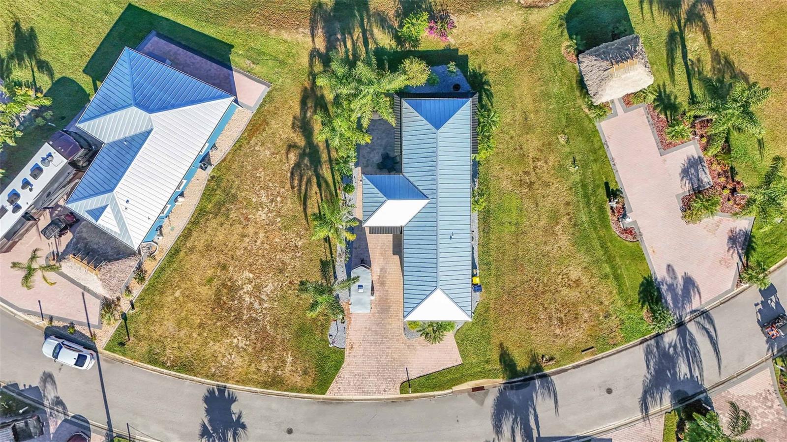 Check out this custom built Casita. With 944 sq ft under air and an large 233 sq ft lanai, it totals 1,177 sq ft under roof. The casita has 1 BR with king bed, and 1 Bath with a stack washer dryer unit. A full size gourmet kitchen overlooks the expansive living room with vaulted ceilings that elevate the feel of the space literally and figuratively.
This property has nearly 1,700 sq ft of pavers with plenty of room for a large coach, golf cart and car. It also has a cozy private rear paver patio area nestled in between the dining and lanai.
Bay Lake Motorcoach Resort is a Class A motorcoach resort offering incredible amenities. Owners and visitors can fill their days with activities and club outings or simply relax and enjoy the resort. Whether in search of community, travel, relaxation or recreation, Bay Lake is your home base for the Florida Lifestyle.
Value and Quality are what you will get with this amazing property!!!