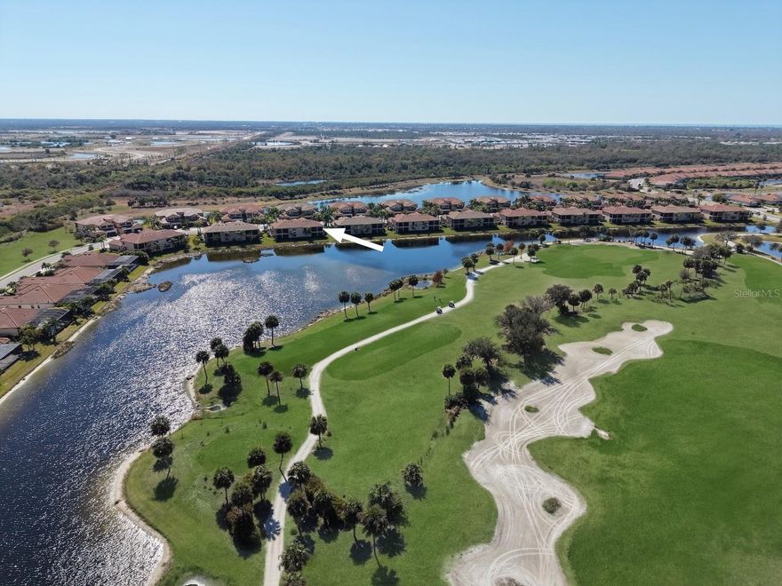 ONE OF A KIND REMODELED UNIT WITH MILLION DOLLAR GOLF & WATER VIEWS! GOLF DEEDED UNIT ! This beautifully upgraded 3 BED, 2 BATH, second-floor coach home offers luxury finishes, bundled golf (membership included in your HOA dues), and stunning WATER & GOLF COURSE VIEWS within the highly sought-after SARASOTA NATIONAL Golf & Country Club community. Meticulously maintained and better than new, this residence features an open-concept floor plan with over $100,000 in CUSTOM UPGRADES throughout and is designed to appeal to the most discerning buyer.

Interior highlights include a professionally designed, walk-in temperature-controlled 400 + BOTTLE WINE CELLAR w/ custom cherry wood wine racks, and travertine flooring. The main living area showcases a CUSTOM MEDIA WALL with built-in FIREPLACE, BUILT-IN BAR area with lacquered cabinetry and accent lighting, and an oversized 11-FOOT KITCHEN ISLAND with custom wood accents and decorative tile detailing. The kitchen is equipped with HIGH-END APPLIANCES, UPGRADED PANTRY, SHAKER-STYLE CABINETRY, AND UPGRADED FIXTURES.

The spacious primary suite features custom wall and ceiling design details, private access to the screened lanai, and views of both water and golf course. Two additional guest bedrooms offer flexibility for guests or office space. Additional features include SMART HOME TECHNOLOGY, HURRICANE IMPACT WINDOWS AND DOORS, generous storage throughout, and an oversized garage with space for two vehicles PLUS golf cart storage / tandem garage space.

The home also features a CUSTOM LAUNDRY ROOM with high-end design details and upgraded washer and dryer.

The unit may be offered TURNKEY/FURNISHED (separate bill of sale), providing a convenient move-in or seasonal ownership opportunity.

A planned golf course renovation is scheduled for this year, and the seller will pay the current assessment associated with the renovation, offering added value to the next owner.

Residents of Sarasota National enjoy access to resort-style amenities including a GOLF COURSE, CLUB HOUSE, MULTIPLE DINING OPTIONS, FITNESS CENTER, RESORT STYLE POOL & SPA, DAY SPA, TENNIS, PICKLEBALL, DOG PARK & MORE! Call today to see your new Florida home!