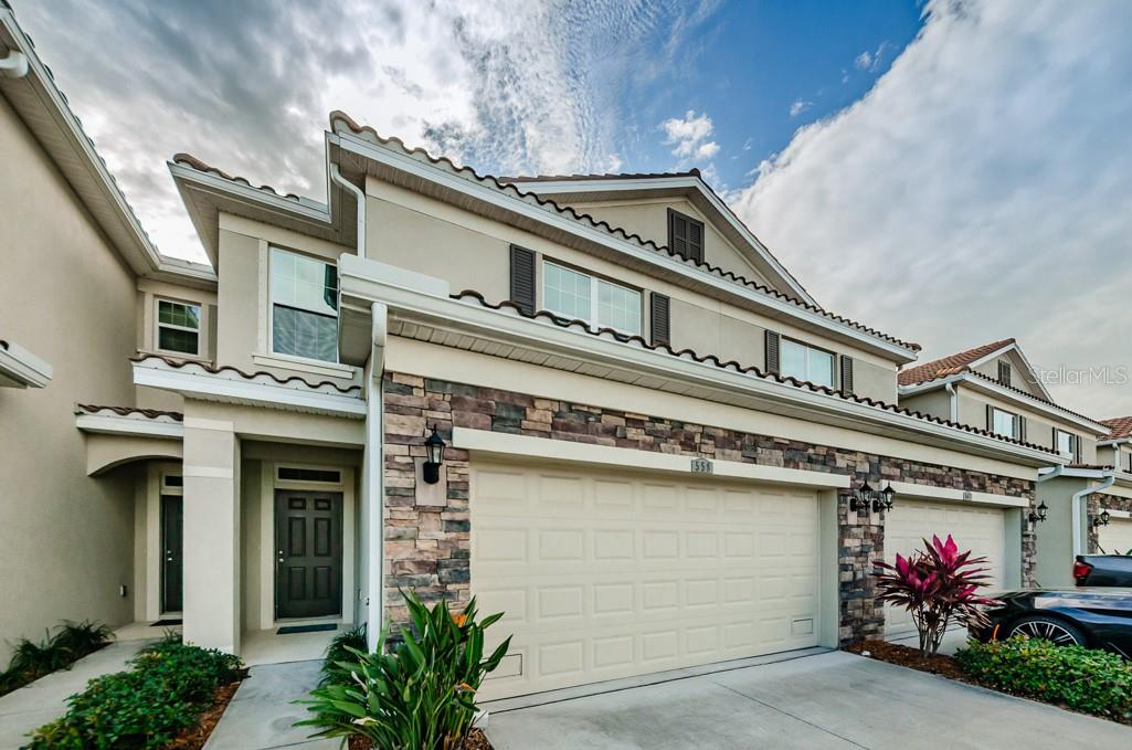 Luxurious Townhome Living in the Heart of St. Pete! Welcome to Colonnade one of St. Pete’s most coveted, centrally located communities. This stunning 3 bedroom, 2.5 bath, 1,995 sq. ft. townhome with a 2 car garage blends stylish upgrades with effortless comfort, just 3 miles from our vibrant downtown. Step inside to an open concept main level where the kitchen, living, and dining spaces flow seamlessly perfect for entertaining. Luxury vinyl plank floors grace the first floor, stairs, and most of the second level, adding warmth and sophistication. Upstairs, a huge primary suite offers your private retreat, joined by two additional bedrooms, a bonus room ideal for a home office or playroom, and a convenient laundry room. Off the family room, sliding doors with custom shades open to a screened patio , perfect for enjoying breezy afternoons. Life at Colonnade means more than just a home it’s a community. Join in on neighborhood events at the resort style pool and pavilion, meet friendly neighbors, and soak in the welcoming atmosphere. With all block construction, hurricane shutters, and a location just off 4th Street, convenience and peace of mind are built in. Perfectly situated only minutes from shops, dining, and all that downtown St. Pete has to offer. Style, space, and community all in one. Available unfurnished. Security Deposit is $3,000; the community has an application fee $100 and background approval process fee for each adult $65; verify community related fees at time of application.