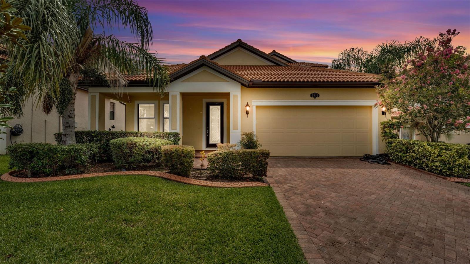 Welcome to 3912 Vista Trace Way, tucked away on a peaceful cul-de-sac in one of Lakeland’s most desirable resort-style gated communities. This beautifully maintained K. Hovnanian 4-bedroom, 3-bathroom home with a dedicated office offers the perfect balance of comfort, style, and convenience for today’s modern lifestyle. From the moment you arrive, you’ll be charmed by the paved driveway and cozy front porch—an ideal spot for morning coffee or unwinding at sunset. Step inside to find upgraded vinyl plank flooring flowing throughout the first floor, creating a seamless and elegant look. The spacious dining room features custom wall trim that adds a subtle designer touch, while the open-concept kitchen and living room are built for gathering and entertaining. The kitchen boasts solid wood cabinetry, granite countertops, and stainless steel appliances—a true heart-of-the-home setup. The primary suite, located privately on the first floor, includes a generous walk-in closet, a garden tub, walk-in shower, and dual sink vanity, offering a relaxing retreat. Two other guest bedrooms on the main floor are tucked away from the living areas with their own guest bathroom. Upstairs, you'll find a massive fourth bedroom with an en-suite bathroom—perfect as a guest suite, home theater, or game room. Sitting on nearly a quarter-acre lot, the backyard offers space to breathe with no direct rear-facing neighbors, a screened-in patio, and room to play or garden. Living here means access to a resort-style lifestyle: enjoy a huge community pool, clubhouse, tennis courts, dock, playground, and scenic walking trails—all included in your HOA, along with internet and cable TV. Location-wise, you’re just minutes from Publix, Walmart, restaurants, and I-4, making commutes to Tampa or Orlando a breeze. Whether it’s grabbing a bite at a local favorite like Ford’s Garage or exploring the nearby Lakeland Square Mall, everything you need is right around the corner. Don’t miss the chance to call this welcoming and well-loved home your own—schedule your private tour today! Floorplan and video tour available!