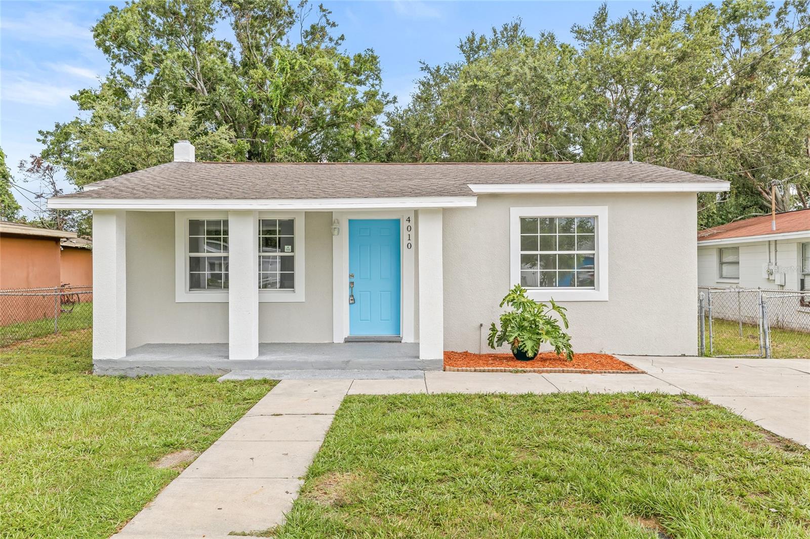 Step into this charming and completely updated 3-bedroom, 2-bathroom home, ideally located in the heart of Tampa. With its eye-catching curb appeal and welcoming covered front porch, this home is perfect for enjoying your morning coffee or relaxing in the evenings. Inside, you'll find a bright and open floor plan where the spacious living room flows seamlessly into the stunning modern kitchen. Featuring brand-new soft-close cabinetry, stone countertops, and stainless steel appliances, this kitchen is both stylish and functional. Just off the kitchen, the sun-drenched dining area is the perfect spot for everyday meals or hosting gatherings. Tucked away off the dining area, you'll find a laundry closet complete with a brand new washer and dryer for your convenience. The primary suite offers a peaceful retreat with airy natural light and a fully updated ensuite bathroom boasting trendy finishes and a fresh, modern design. At the front of the home, two additional guest bedrooms are filled with natural light and share a tastefully renovated guest bathroom—perfect for family, friends, or a home office setup. Step outside to the fully fenced backyard, ideal for entertaining, barbecues, or simply letting the kids or pets play freely. Located near some of Tampa’s best restaurants, activities, and just minutes from major highways, this home offers both convenience and a vibrant lifestyle. Don’t miss your chance to make it yours!