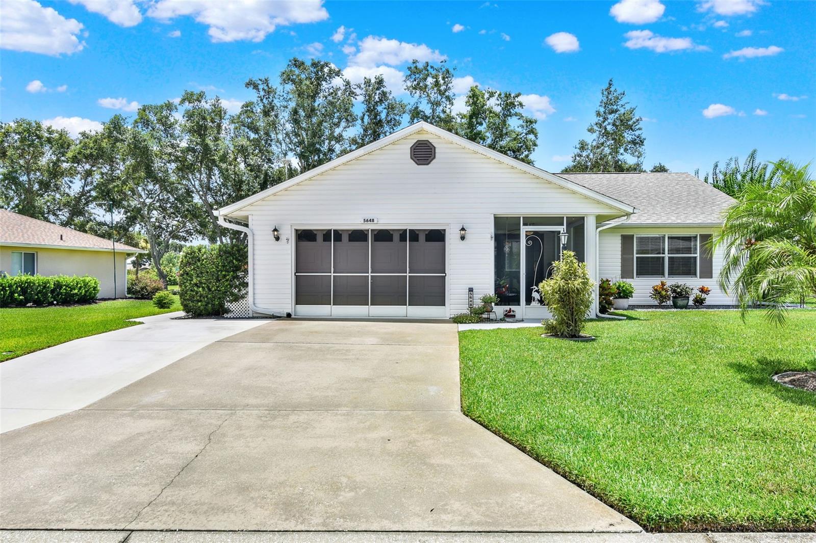*LOOKS LIKE HGTV* MOVE-IN READY* You must see this cute, immaculate little house! Enjoy your mornings or evenings relaxing on the screened front porch with a ceiling fan. Step into the good-sized living room and see the beautiful luxury vinyl plank flooring that continues through the entire home. Easy care and no allergies here. Fans and lighting have been updated throughout.Beyond the living room, you'll find the perfect, light-filled room for enjoying the yard, reading or quiet conversation. The dining room has nice corner windows. Off of the dining room, you'll see the kitchen, with lots of cabinets, counter top space, pantry cupboard and a sunny bay window eating nook. On the other side of the home there is a nice sized bedroom with wonderful light and good closet space. The hall has 2 closets and leads to the second bathroom, with a long counter, tall commode and a tub/shower combo. The primary bedroom is a very good sized room with closets across the entire end of the room. Step-in shower, tall commode, big sink and vanity area make up the ensuite bathroom. A door in the den leads out to a big patio, surrounded by a cute little fence. All of the landscaping is very pretty and neat. The garage has peg board all around and will hold 1 car and a golf cart. Gutters on the front of the home have Leaf Filter installed. Roof 2013. Water heater and electric panel have been replaced. HVAC 2017. Driveway extension and sidewalk 2024. Transferable termite contract with Creative Pest Solutions. Termite inspection 7-16-2025. All of this is the wonderful, friendly, active, gated, 55+ community of Highland Lakes. Enjoy indoor and outdoor pools, tennis and pickleball. Other sports are bocce. shuffleboard, horseshoes and softball. The beautiful clubhouse contains a billiard room, craft room, library, fitness room, card playing room and a large arena with a walking track. Bingo, dinners, concerts etc are also held in the arena. Free boat and RV storage. Great craftsman shop for your use. Location is near groceries, restaurants, banks, and major highways. Come see this home right away!