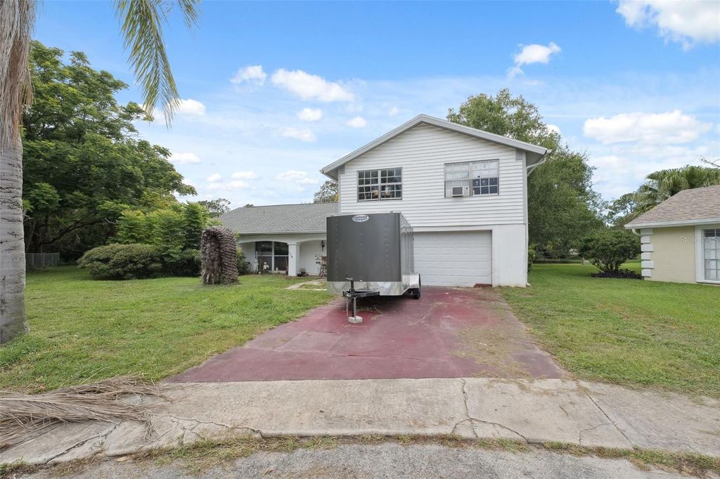 Photo of 8018 Wildflower Row, Hudson, FL 34667 (MLS # W7877243)
