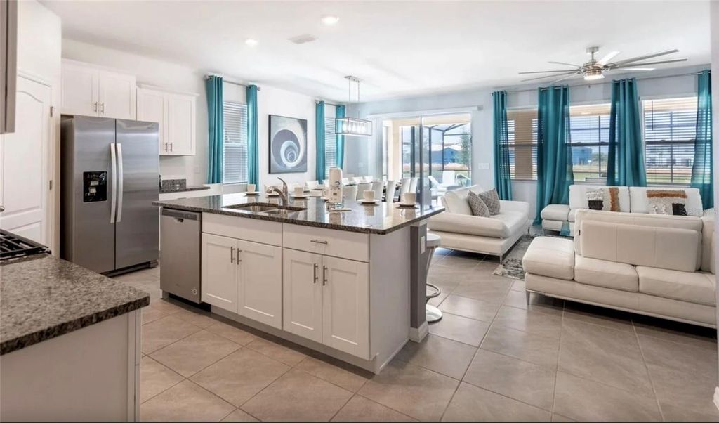 Photo of 7572 Oakmoss Loop, Davenport, FL 33837 (MLS # O6417656)
