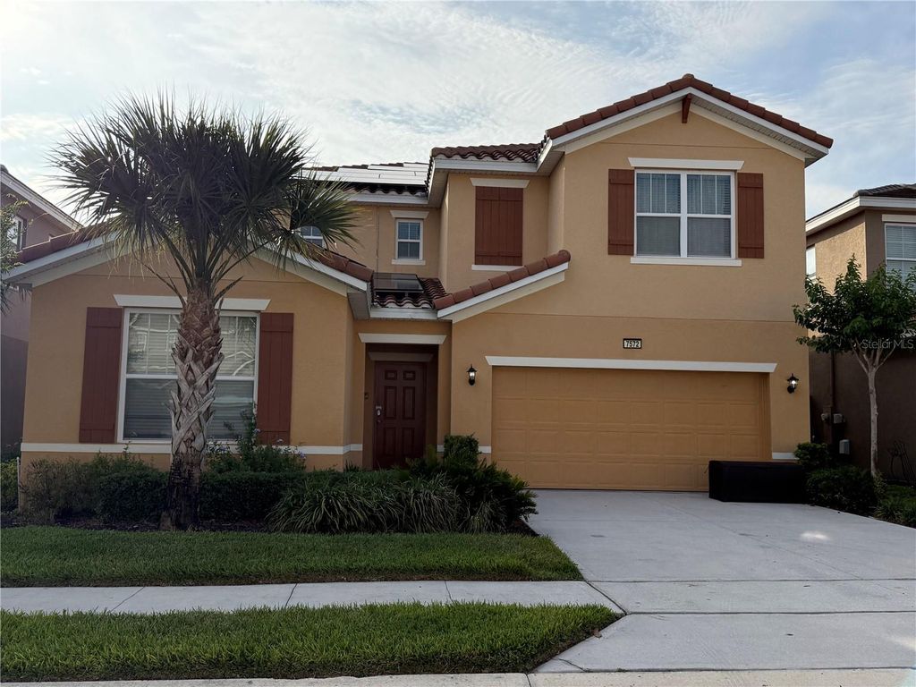 Photo of 7572 Oakmoss Loop, Davenport, FL 33837 (MLS # O6417656)