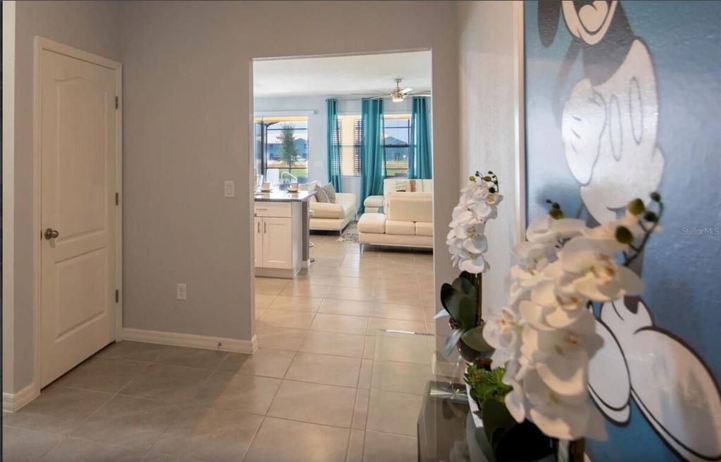 Photo of 7572 Oakmoss Loop, Davenport, FL 33837 (MLS # O6417656)