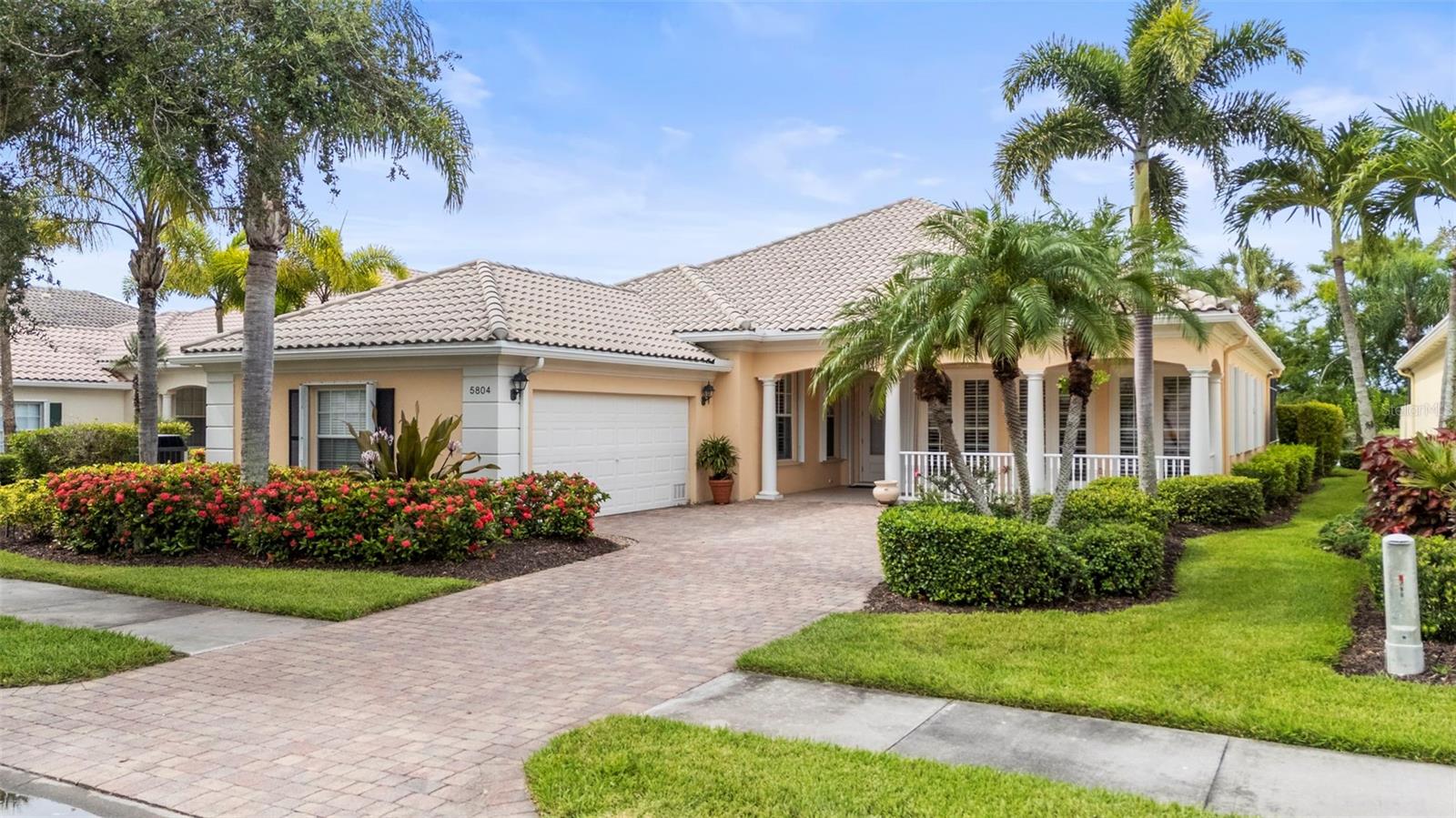 Million-Dollar View Without the Price Tag! Experience spectacular waterfront living in this highly sought-after Carlyle model home in the resort-style community of VillageWalk on Palmer Ranch. Boasting a premium south-facing lake view, this beautifully maintained residence offers 5 bedrooms, 3 full bathrooms, and absolutely no carpet—tile flooring and engineered wood throughout for easy maintenance and modern style. Step inside to a light-filled living room with a neutral color palette and large front-facing windows. The spacious family room features soaring 12-foot ceilings and sliding glass doors that open to your private pool—perfect for soaking in that stunning water view.
The primary suite is a true retreat, complete with tile floors, a walk-in closet with built-in organizers, three additional closets, and a spa-style ensuite bath with dual vanities, a soaking tub, and a separate shower. There are four guest bedrooms, including a converted formal dining room that adds flexibility for guests, a home office, or multi-generational living. You'll love the outdoor living space—an extended, screened-in lanai with your own private pool overlooking the tranquil lake. It's the perfect place to relax, entertain, and enjoy the Florida lifestyle. Additional highlights include Plantation shutters, Accordion hurricane shutters, central vacuum system, newer air conditioner and water heater. Built solid by DiVosta with poured concrete and reinforced construction. VillageWalk is a gated, master-planned community set on 500+ acres of lush landscaping, lakes, and walking trails—perfect for biking or golf cart rides. Enjoy resort-style amenities including:
geothermal heated Resort pool, geothermal heated lap pool, 6 har-tru tennis courts, pickleball courts, basketball court, bocce ball,
state of the art fitness center, Tiki bar, boutique, gas station, restaurant and bar. There is a monthly calendar filled with great activities. Located near Siesta Key Beach, Legacy Trail, Costco, shopping, dining, and top medical facilities—VillageWalk offers the best of Sarasota living. Schedule your private showing today—this one won’t last!