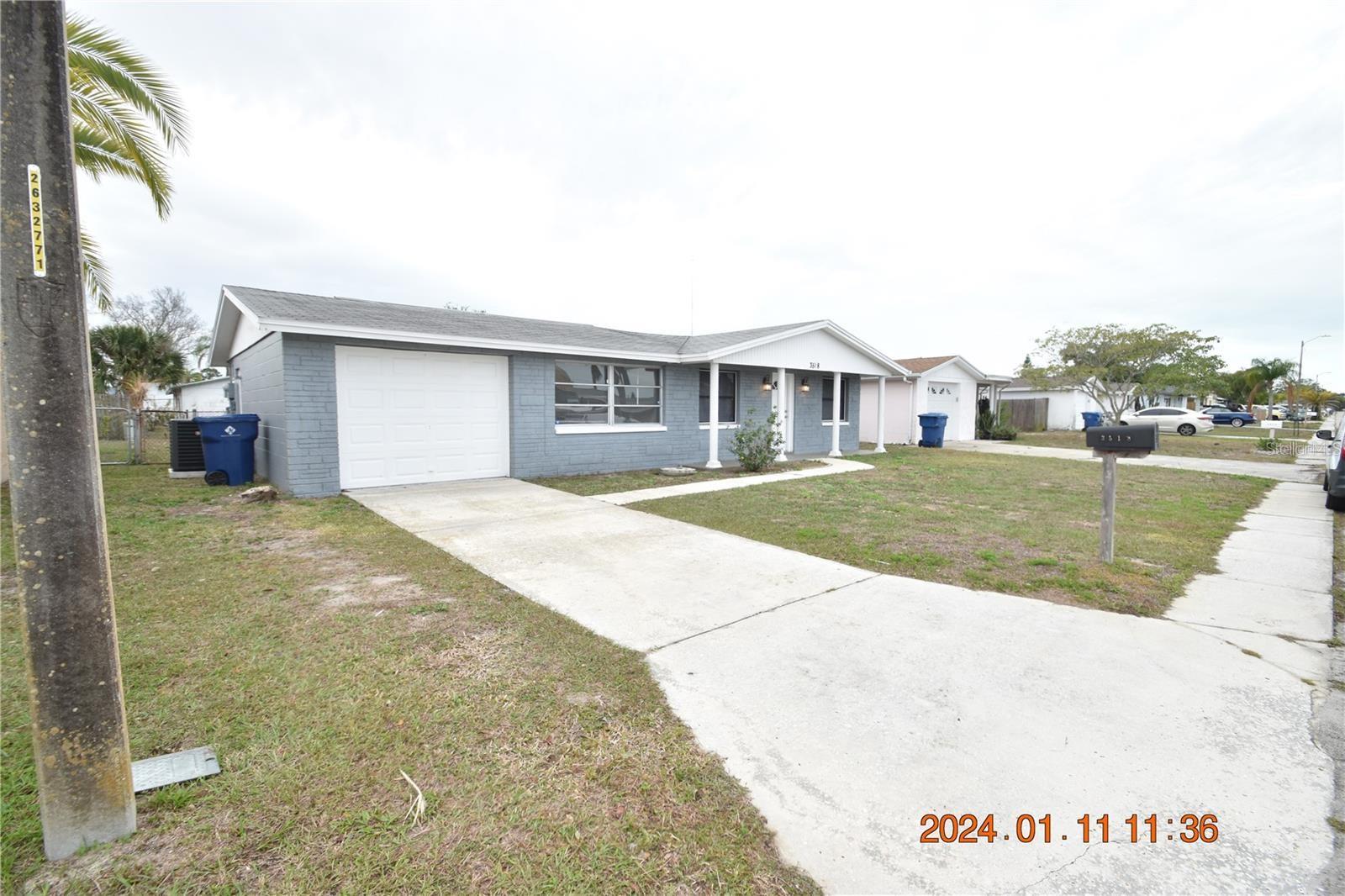 4?Bedroom, 2 Bathroom 1 car garage block home in Holiday. the most affordable 4-bedroom listing in Holiday at time of posting—featuring an attached garage and a large fenced-in backyard. The interior includes ceramic tile and vinyl flooring—no carpet—along with a spacious living room, ceiling fans, window blinds, central AC and heat, kitchen with glass-top range, refrigerator, dishwasher, ample cabinet and counter space, and a breakfast bar adjoining the dining area. The primary bedroom includes a walk-in closet and private bath. There are no HOA, deed, pet, or lease restrictions, offering flexibility for homeowners and investors. Conveniently located near US-19 with easy access to shopping, services, and Gulf beaches. This home did not flood or sustain any damage during the 2024 hurricanes. Used as a rental for several years; seller requires all offers to be net to seller, and buyer must sign the seller’s standard investor addendum.