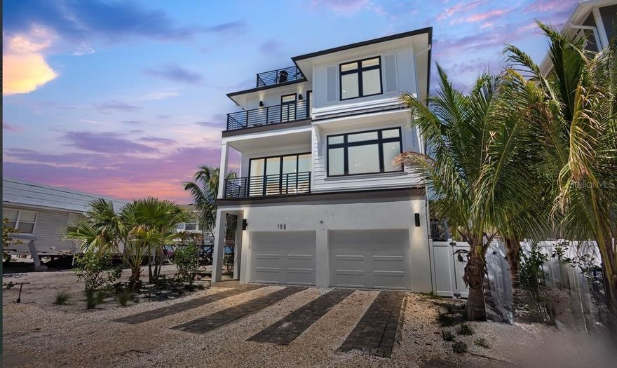 INCREDIBLE GULF VIEWS IN THIS NEW CONSTRUCTION HOME! Where sunrises meet sunsets, this Bradenton Beach estate offers the ultimate blend of luxury and comfort. This extraordinary seven bedroom, seven and a half bathroom estate is the ultimate in luxury coastal living. Perfectly designed for both entertaining and relaxation, the home combines elegant modern design with the laid-back charm of Anna Maria Island. Just steps from the sugar-white sands and turquoise waters of the Gulf of Mexico, the property delivers a lifestyle of comfort, beauty, and convenience.



Inside, the open-concept layout features expansive living areas with floor-to-ceiling windows that flood the rooms with natural light and frame breathtaking views of the water. The gourmet kitchen is a true centerpiece, complete with a massive center island, quartz countertops, high-end appliances, and generous seating for family and guests. Designer touches, coastal-inspired décor, and seamless indoor-outdoor transitions create an inviting and serene atmosphere throughout the home. Each of the seven bedrooms includes its own en-suite bath, offering privacy and comfort. A custom bunk room adds a playful yet practical touch, making the residence ideal for hosting large families or groups.



Outdoors, a private heated pool and spa are surrounded by lush landscaping and a shaded lounge area, creating a resort-like retreat perfect for relaxing or entertaining. The rooftop deck is the crown jewel of the home, providing panoramic views of both the Gulf and the Intracoastal Waterway. This rooftop oasis offers a spectacular setting for morning coffee, evening cocktails, or simply soaking in the island’s natural beauty.



Located on the sought-after barrier island of Anna Maria, this estate places you within walking distance of charming local shops, beachfront dining, and island entertainment. The area is known for its pristine beaches, boating, fishing, paddleboarding, and the welcoming small-town feel that makes Bradenton Beach so special, while still being within easy reach of Sarasota and Tampa for additional cultural and city conveniences.



Whether you are seeking a private family retreat, a luxury vacation rental, or a forever home by the sea, this Bradenton Beach estate offers an unparalleled opportunity to embrace the best of Florida’s Gulf Coast lifestyle.