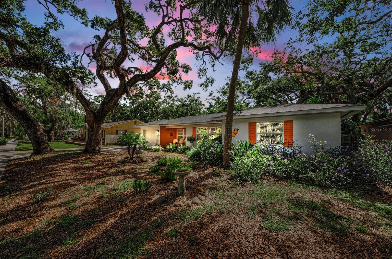 Rare opportunity for a beautifully renovated Delightful Dunedin home settled among historic bungalows,
stately live oaks and within 3 blocks to downtown Main Street. This truly delightful 2 bedroom, 2
bath, 1 car garage, 1 golf cart pavered carport home offers charm, fun, location and so many newer and desirable features. The pavered driveway, walkway, and covered front porch welcome you into this inviting
home. When you enter you will love the open feeling, the designer touches, the wood-look porcelain tiles
throughout and great floor plan. The Living Room is perfect for TV with extra space for your guests who will
love to come visit. The Dining Room can seat a large family and has a view of the historic neighborhood. Enjoy the updated kitchen with newer cabinets, appliances, gas range with hood exhausted to the outside,
drawer microwave, quartz counters and peninsula pass-through to the Dining area. Bedrooms are spacious,
have roomy closets, are off a hallway offering privacy and share a fully renovated bath. Additional upgrades,
improvements and features are numerous and include: in-home natural gas, on-demand tankless hot water
heater, all new doors, lighting fixtures, whole house fan and yard is fully fenced. A second bath and laundry
room is conveniently accessed off the covered lanai and features a newer washer and dryer, updated laundry sink, toilet and exterior window. Relax sitting in the screened lanai overlooking your artfully landscaped
back yard. Meander the park-like walkway through the tropical foliage enjoying the patio, cooling shade,
perfect place for a hammock and verdant sitting areas. A custom shed with a charming front porch adds to
the enticing space. Conveniently backing to the Pinellas Bike Trail will put you just a short walk or bike ride
to downtown, the gorgeous waterfront overlooking Clearwater Beach, the Blue Jays Stadium, Hale Activity
Center, Dunedin Library, restaurants, craft breweries, shopping and all Dunedin offers within just a few
blocks in this Golf Cart approved city. Enjoy the festivals, spring training, open air markets, parks, beaches,
Community Center, City Pool, Dunedin Golf Club, State Parks, Marina, Boat Ramp to the Intercoastal Water
way and Gulf. Easy commute to the Tampa Airport, the Arts, Cruise Terminals and Championship Sports. This
home and lot remains high and dry and did not sustain any flood/water damage during the 2024 hurricanes.
Come live a true Florida Lifestyle! Wine Fridge in Dining Room does not convey.