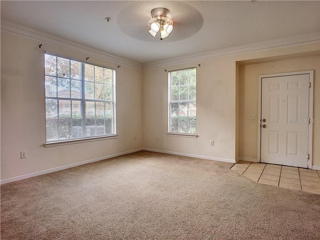 Photo of 12824 Madison Pointe Circle #103, Orlando, FL 32821 (MLS # O6395790)