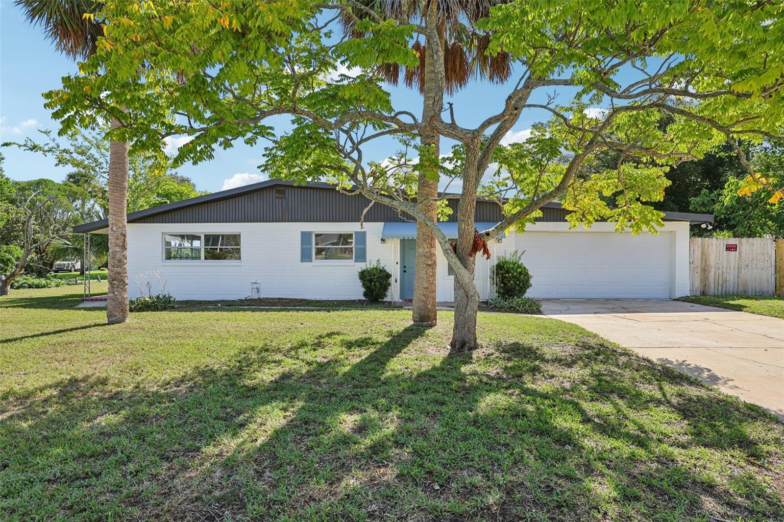 Discover this beautifully updated modern home tucked away in a peaceful neighborhood just minutes from Daytona Beach. Step into a thoughtfully renovated 3-bedroom, 2-bath residence designed for both entertaining and everyday living. Elegant luxury vinyl plank flooring flows throughout bright, inviting spaces and opens to a generous backyard—ideal for gatherings or quiet relaxation. The kitchen shines with brand-new quartz countertops and stainless-steel appliances, while the primary suite offers a private escape complete with a stylishly remodeled bath featuring quartz finishes. Combining contemporary design with everyday convenience, this home is perfectly situated near shopping, dining, hospitals, major highways, and of course, the beach. Don’t miss your chance to make this stunning home your own!