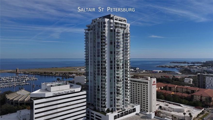 Luxurious condominium at 301 1ST ST S UNIT 2305, Saint Petersburg, FL 33701. This residence features two bedrooms plus a flexible studio/office or bedroom, two and a half baths, and 1,663 sq. ft. of elegantly designed living space. The interior boasts tile flooring, ten-foot ceilings, floor-to-ceiling windows, and custom cabinetry in walk-in closets. Modern amenities include programmable Hunter Douglas shades, a dedicated laundry room with Whirlpool appliances, and high-speed wired internet in every room, for secure remote work. Two reserved parking spaces, owner storage, and bike storage are included.