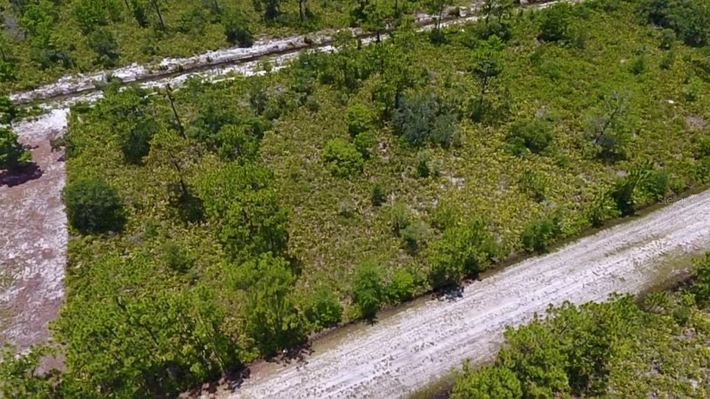 Photo of 113 Bougainville Drive, Indian Lake Estates, FL 33855 (MLS # L4954644)