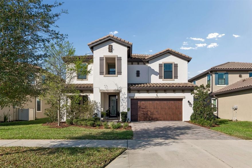 Located in the highly sought after Starkey Ranch community of Odessa, this spacious 6 bedroom, 4 bathroom home offers an exceptional layout, modern upgrades, and a prime location directly across from a neighborhood park. With beautiful curb appeal, a paver driveway, and a welcoming front porch, the home opens to a bright, open concept floor plan designed for both everyday living and entertaining. The main living area flows seamlessly into the dining space and gourmet kitchen featuring quartz countertops, Café appliances, stylish backsplash, modern lighting, a large center island with bar seating, and a walk in pantry. A full bedroom and bathroom on the main floor provide flexibility for guests, multigenerational living, or a private office, while the 3 car tandem garage offers excellent storage. Upstairs, a large loft area creates the perfect media room, play space, or second living area, surrounded by multiple bedrooms and bathrooms including a private ensuite guest suite. The spacious primary suite offers abundant natural light, room for a sitting area or workspace, and a spa-style bathroom with dual vanities, a frameless glass walk-in shower, and an oversized walk-in closet, with a convenient upstairs laundry room nearby. Outside, the private backyard features lush landscaping and a large patio with plenty of room to add a pool, creating a great setting for outdoor living. With its rare 6-bedroom layout, flexible spaces, and desirable Starkey Ranch location near parks, trails, and community amenities, this home offers the space and lifestyle you are looking for. Solar is an extra bonus for saving on all the electric bills.