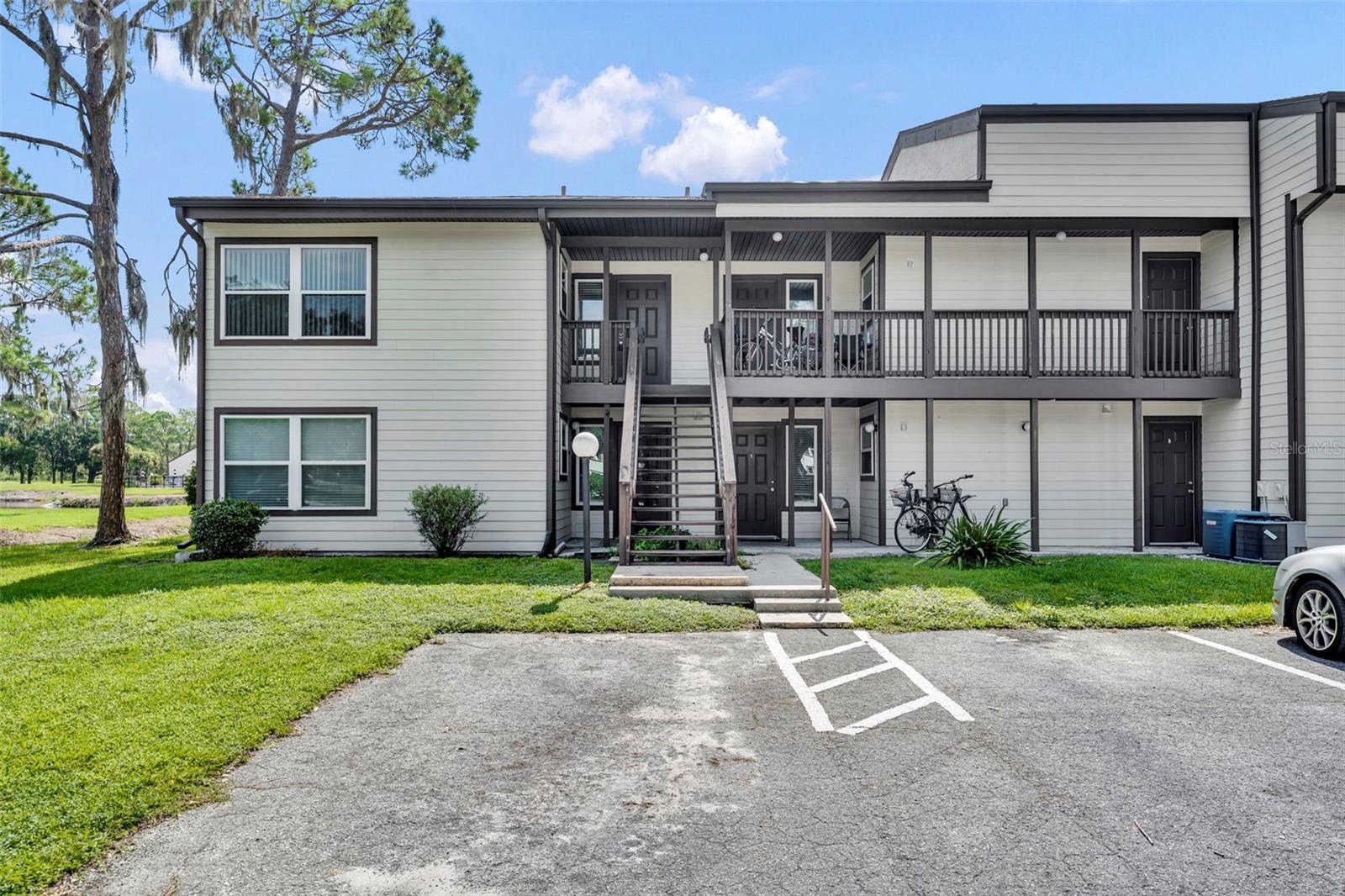 Welcome to worry-free, maintenance-free living in the charming and affordable Sandalwood community. This beautifully renovated 1-bedroom, 1-bathroom condo offers exceptional value and convenience with water view, ideally located just outside The Villages. Featuring fresh interior paint, updated flooring, and a modernized kitchen, this unit is move-in ready and perfect for anyone looking to enjoy a vibrant lifestyle without the high costs of living within The Villages. Enjoy easy access to everything you need—restaurants, shopping, top-tier medical facilities, and the lively entertainment of multiple town squares—all just minutes away. Affordable, updated, and perfectly located, this condo is an ideal place to call home.