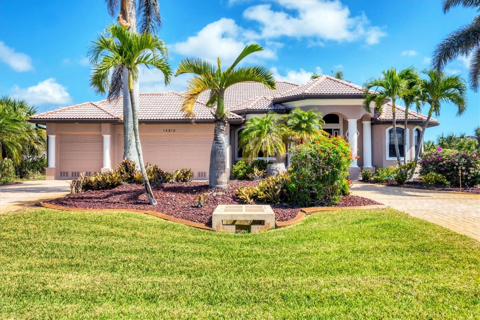 WATERFRONT POOL HOME WITH DOCK & 16K COVERED BOAT LIFT!
This thoughtfully designed 3-bedroom, 3-bath, 3-car garage canal-front home offers a solid layout, beautiful views, and plenty of potential to make it your own.
INTERIOR FEATURES & LAYOUT
Enjoy water views the moment you walk in. The light-filled open floor plan flows easily through the great room, featuring detailed tray ceilings, ambient rope lighting, and multiple sliding glass doors that open to the lanai and pool. The window in the dining area and the sliders have tint for added comfort and energy efficiency. A spacious den or flex room near the entry is perfect for a home office, hobby space, or library. The guest bedrooms can be closed off from the main living areas, offering privacy for family or friends.
GOURMET KITCHEN & ENTERTAINING
The upgraded kitchen is designed for both everyday living and entertaining. It features custom cabinetry, stainless steel appliances, granite countertops, and a large bi-level island with bar seating. Several lower cabinets include wooden pull-out shelves for easy storage and organization. An aquarium-style window in the dining area frames a beautiful water view. The kitchen opens to the great room and dining area, making it ideal for gatherings.
PRIMARY SUITE & BATHS
The private owner’s suite offers direct lanai access, a walk-in closet, and a spa-inspired bathroom with a jetted tub and an oversized walk-through shower with dual shower heads and controls. Two additional bedrooms and baths provide flexible space for family, guests, or a second office. The third bath also serves as a convenient pool bath, accessible from both the hallway and the pool deck.
OUTDOOR LIVING & WATERFRONT ACCESS
Step outside to your own slice of paradise. The oversized screened lanai features a heated saltwater pool with beach entry, five fountains, and a sun shelf—perfect for lounging and entertaining. The exterior was recently painted and includes concrete curbing, upgraded landscaping, and a circular paver driveway with plenty of parking. For boating enthusiasts, there’s a composite dock with a 16,000 lb covered boat lift and a straight canal view that provides quick Gulf access. A walkway runs from the front of the home to the back along the side, leading to an outdoor shower and a storage closet for pool equipment and accessories.
ADDITIONAL UPGRADES & HIGHLIGHTS
• Impact-rated windows (except dining window) and doors
• Tinted sliders and dining window
• Tray ceilings with accent lighting
• Tile throughout main areas
• Saltwater pool with fountains and sun shelf
• Outdoor storage closet for pool equipment
• Outdoor shower and side walkway
• Circular paver driveway and concrete curbing
• Guest bedrooms can be closed off from main living areas
• Coat closet, ceiling fans, and attention to detail throughout
Enjoy the best of Southwest Florida—boating and fishing right from your backyard or simply unwind with your favorite drink while taking in the peaceful canal view. This home is the perfect combination of waterfront comfort, outdoor living, and move-in ready style.