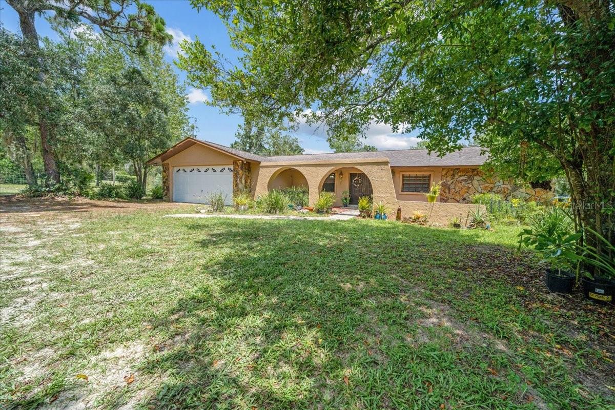 SELLER is MOTIVATED! Potential UNLIMITED. If you’ve been searching for space, functionality, and freedom — this property checks all the boxes. Situated on 2.4 fully fenced acres, this 2,584 square foot home offers 5 true bedrooms, 3 FULL bathrooms, a great outdoor space for entertaining, and an incredibly flexible layout that could be a match for multi-generational living, home-based business, or simply spreading out. Bring your toys and tools! The 1,200 square foot detached garage provides ample storage or workshop space, and the additional pole barn includes an RV septic pump-out station — a rare and valuable feature for RV owners. While the home could benefit from some cosmetic updates, the solid floor plan and size showcase a fantastic foundation to make it your own. With this location you get the perks of a desirable area without the HOA or restrictions. A true blend of rural comfort and convenience — this is an opportunity with endless potential.