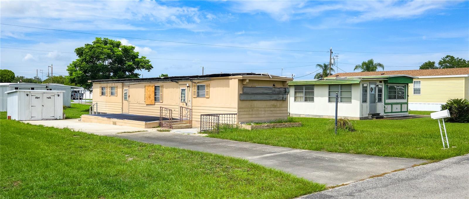 A nice property in Betmar Acres a 55 + community where you own the land. This home had the car port ripped off and the front of the home is a little damaged, but the rest of the home is in good shape if someone would like to fix it up OR put in a new mobile and you do not have to pay the impact fees. Home is AS/IS no power or water. This is a cash-only sale, and just a little TLC is needed, but this one has great bones call today to schedule your showing and enjoy Betmar and all the amenities to include Walking trails over bridges and ponds, 2 swimming pools, 2 hot tub, tennis, pickle ball, basketball, bocce, 27 holes of golf, shuffleboard, mini golf, billiards, game rooms, library, clubhouses, planned activities, Bingo and fun events.