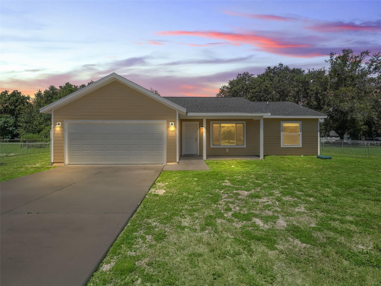 Welcome to your dream home! This newer-built, three bedroom, two bath beauty features an open floor plan perfect for entertaining. Enjoy sleek stainless steel appliances and stylish laminate vinyl flooring throughout the house and no carpet. The large fenced in yard and covered patio area offers plenty of space for outdoor activities. Don't miss out on this fantastic home.