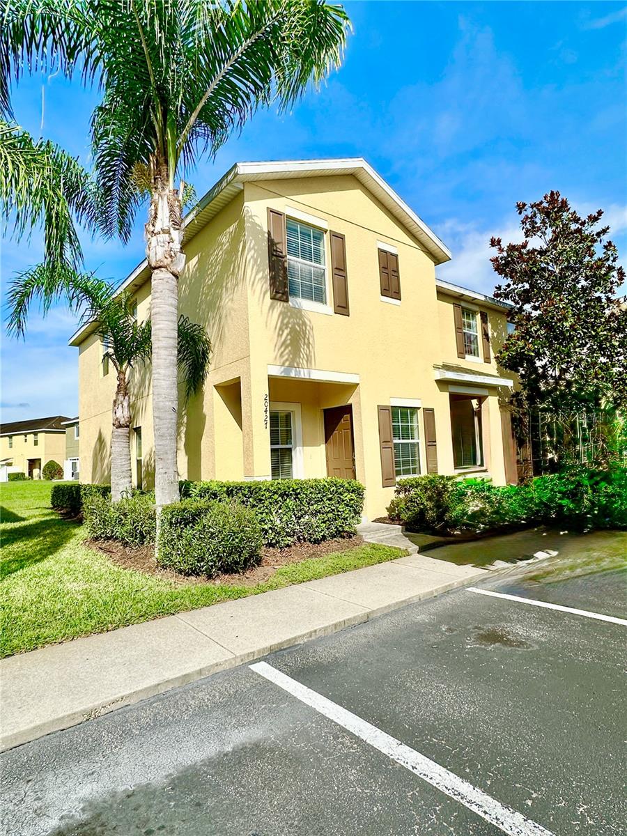 This beautiful 2-bedroom, 2.5-bathroom townhome is in the highly desirable gated Hammocks community known for its mature landscaping and resort-style amenities. This condo offers two upstairs master suites, each with its own private bathroom. The Open-concept kitchen features granite countertops, stainless steel appliances, an eat-in area, and plenty of cabinet and counter space. Tile flooring runs throughout the main level, including the living room, which includes built-in shelves and a laundry closet. Sliding doors off the kitchen lead to a brick paver patio overlooking a grassy area—great for relaxing or outdoor dining. Large master suite with walk-in closet and private en-suite bathroom featuring dual sinks and stand-up shower. Second bedroom with its own full bathroom—perfect for guests, roommates, or a home office. Assigned parking is conveniently located just outside the unit. Community amenities include a swimming pool, clubhouse, and fitness center, all within walking distance. Located near major highways (I-75, I-275), USF, Wiregrass Mall, shopping, dining, and healthcare. A practical and convenient option in a great New Tampa location. $150 admin fee due prior to move in.