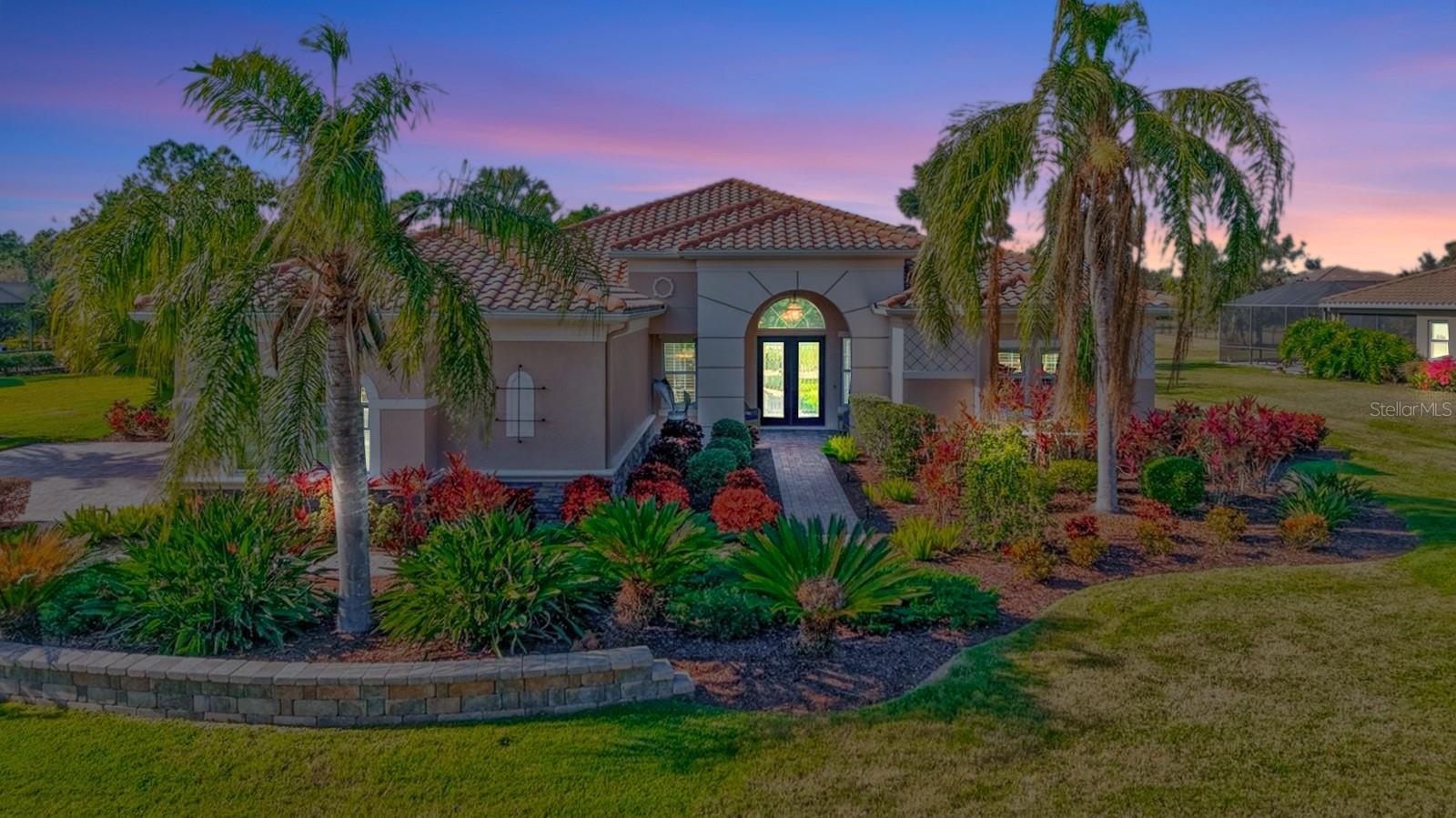 True Florida living with style and space. Fantastic estate home situated on the most incredible 0.53-acre lot with pond/preserve view, in the sought after Rye Wilderness Neighborhood. Spanish style architecture and a charming front porch with arches sets the stage for this spacious, at 3,451 sq/ft. This egret model, newly updated pool equipment, stunning interior and endless beauty of the pond/preserve view. tile roof, paver driveway and a three-car side load entry garage. This is a lovely four bedroom/three-bathroom, w/office home, tile feature wall butler's pantry with tiled back splash and exceptional kitchen. Newly painted interior living room and kitchen. Upon entering the double eight ft front doors, you will be greeted by twelve ft ceiling foyer, ten ft ceilings in the rest of the home with incredible tray ceiling accents, to your left find a lovely dining room area and even larger living room with sliders looking out to the lanai, pond and preserve. This living room is adjoined with long countered butler's pantry/wet bar w/sink. Heading further into the home a glorious gourmet kitchen featured with a center island, gorgeous granite, breakfast bar, decorator vented hood to the outside, under counter lighting and solid wood cabinetry with pullouts. The kitchen opens to a family room with additional sliding doors that enter the splendid lanai area. The second and third bedrooms share a full bathroom in the interior. As you walk from the front entry to the right there is the office. Further is the grand master suite with tray ceilings, sliders to the lanai, large California style walk in closet, a second open storage walk-in closet ensuite master bathroom with magnificent dual sinks, make up area, garden tub and larger walk-in shower. The spacious laundry room has extra wood cabinetry. The covered lanai area is an impressive space looking onto a magnificent heated pool, paver deck makes this the ideal outside area perfect to enjoy the beautiful Florida weather. Rye Wilderness Preserve is just north of the neighborhood, kayaking and canoeing a favorite. Rye Wilderness Neighborhood is close to the interstate, just north of Lakewood Ranch, thirty minutes to some of the world-famous beaches, near top-rated schools, equally close to St-Pete, and Sarasota and an hour to Tampa for its' International airport, restaurants and professional sports. NO CDD's in this neighborhood and a LOW HOA. TWO BRAND NEW AC SYSTEMS