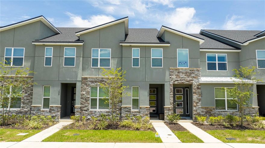 Welcome to an extraordinary opportunity in the highly sought-after Solara Resort in Kissimmee, Florida. This impeccably appointed 5-bedroom, 4.5-bath townhome is a true statement of luxury, offering an exceptional furniture and professionally decorated by an interior decorator curated for both elegance and comfort. Whether as a private retreat or investment property, this townhome delivers an elevated vacation experience. From the moment you step inside, you are greeted by a open-concept layout featuring a designer kitchen with modern finishes, an elegant dining space, and a beautifully styled living room that flows seamlessly for effortless entertaining. Every detail has been thoughtfully selected — from statement lighting to premium finishings — creating a warm yet refined ambiance. The primary ensuite is conveniently located on the main floor, providing privacy and convenience. A stylish half bath with direct access to the private pool area enhances functionality for guests enjoying the outdoor oasis. The covered patio and private pool create the perfect setting for relaxation after a day at the parks. Upstairs, a spacious loft offers a secondary lounge or entertainment space. The upper level features two additional ensuite bedrooms and two more exquisitely themed bedrooms that share a full bath. Each themed room has been professionally designed to captivate all guests, making this home especially desirable for short-term rentals. A dedicated laundry closet completes the second floor for added convenience. Smart Thermostat, Private Pool and much more. Located just moments from the Solara resort clubhouse, residents and guests enjoy access to world-class amenities including a resort-style pool, fitness center, sports courts, dining options, and entertainment areas.