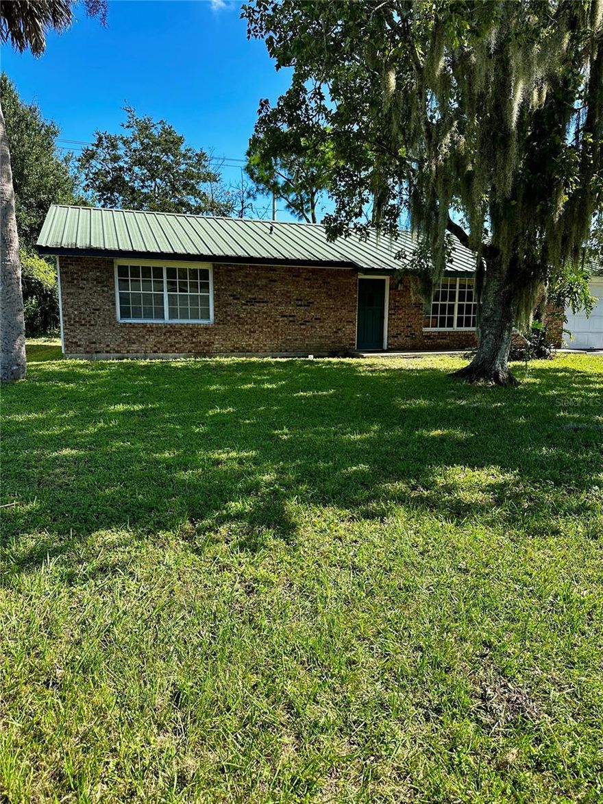 INVESTOR ALERT! Opportunity is knocking in this Fl Shores 3/2 bath Ranch Style home with garage on a high and dry lot that has had not flooded  in any storms & never lost power! Interior needs remodeling but with a some work this home will be Amazing! The metal roof is from (2011) The lot is beautiful too. The possibilities are only limited by your imagination! Schedule your showing today!