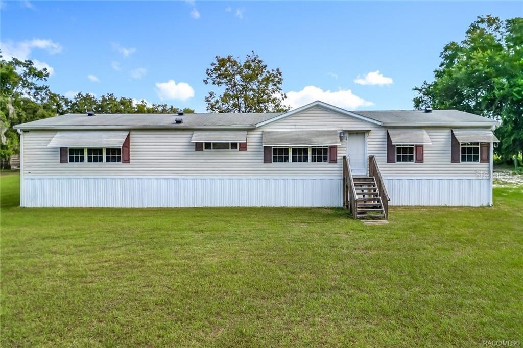 This well-maintained 3-bedroom, 2-bathroom home offers 1,792 sq. ft. of living space on a generous 0.93-acre lot, providing a peaceful setting just minutes from some of Florida’s most sought-after natural springs.
Inside, you'll find a large sitting room with a cozy fireplace—ideal for gatherings or quiet evenings at home. The layout is open and inviting, with abundant natural light and plenty of potential to personalize. Seller is offering a $5,000 credit toward new flooring, which can be completed prior to closing, allowing you to move in with peace of mind and your own design choices.
Located just steps from Lake Rousseau, the property includes deeded access to a separate vacant lot for direct water access—perfect for fishing, boating, or kayaking. You'll also be within 10 minutes of the crystal-clear Rainbow River and a short drive to Crystal River, known for its charming waterfront restaurants, manatee tours, and annual festivals.
NEW WELL AND SEPTIC!
Whether you're looking for a permanent residence, vacation home, or investment opportunity, this property offers a rare combination of space, location, and value. No HOA, no lot rent and NO flood zone!