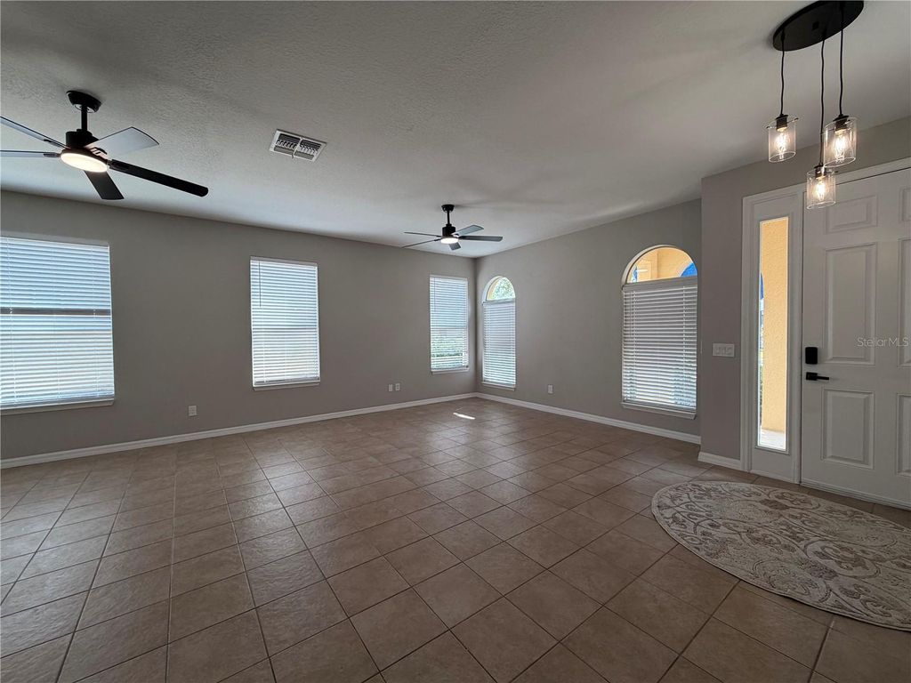 Photo of 528 Orange Cosmos Boulevard, Davenport, FL 33837 (MLS # O6402196)