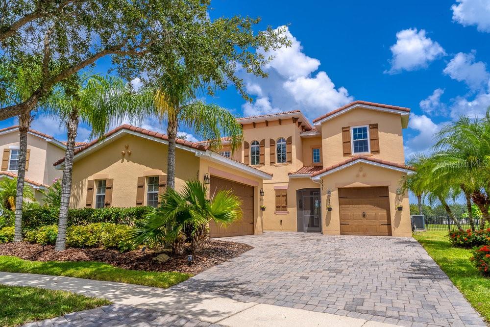 Modern farmhouse meets lakeside luxury. $100K+ In Thoughtful Upgrades — New Custom Windows — New A/C (10-Yr Transferable Warranty) — New Smart Water Heater (12-Yr Warranty) — Sunset & Water Views From Nearly Every Room — Abundant Wildlife — 35 Minutes From Disney & Universal Attractions. Welcome to a rare opportunity in the award-winning, master-planned, gated community of Bellalago, where thoughtful design, tranquil views, and high-end upgrades come together on one of the largest lots in the neighborhood. From the moment you step inside, you're greeted by a dramatic 20-foot entry ceiling, premium wide-plank flooring, and expansive custom picture windows that frame the breathtaking backyard retreat. This 4-bedroom, 3-bath home offers the perfect blend of modern elegance and timeless warmth, featuring custom 2-tone cabinets, fresh painted throughout, farmhouse-style fixtures, iron baluster staircase, and professionally painted 8' doors for a cohesive, designer feel. Step outside into your screened-in lanai with dual sliding glass doors seamlessly connecting indoor comfort with Florida’s natural beauty. The beautifully landscaped, fully-fenced backyard boasts fruit trees, a butterfly garden, and flowering bushes— all centered around a custom patio ideal for entertaining or unwinding under the stars. With private access to Lake Tohopekaliga, you have the opportunity to fully explore one of the premier bass fishing lakes in the country. Live everyday like you're on vacation in your own private oasis where sunsets, water views, and wildlife are now part of your daily routine. Recent and on-going investments in the area have brought in new and exciting dining, shopping, and lifestyle destinations. Ongoing and future infrastructure enhancements are set to further improve connectivity to the greater Orlando area. Schedule your private showing today and see why Bellalago is one of Central Florida’s best-kept secrets!