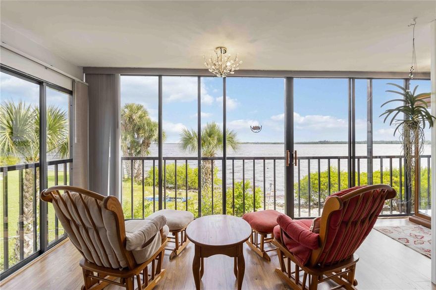Experience the best of Florida waterfront living in this cherished PRIME END UNIT CONDO at Tarpon Bay! Enjoy uninterrupted panoramic views of the Myakka River and Port Charlotte Harbor from nearly every room — the living area, kitchen, and primary suite — or relax in your fully enclosed 21’ Florida room that brings the outdoors in year-round. Open the multiple sliding doors and experience the fresh air off the river through your floor-to-ceiling screened enclosure, creating a seamless connection between indoor comfort and the natural beauty outside. This desirable end unit offers additional windows for abundant natural light and privacy, setting it apart within the community. The remodeled kitchen is a rare find, thoughtfully redesigned with wood cabinetry, granite countertops, a pantry closet, and an inviting breakfast bar — perfect for casual dining. It features new appliances, including a Bosch dishwasher, and a full-size stacked washer and dryer for ultimate convenience. Recent upgrades include impact windows, new flooring and paint, a new 3-ton AC, a tankless water heater, and Pergo flooring throughout (with plush new carpeting in the second bedroom). This home comes partially furnished and move-in ready — ideal for those seeking easy, maintenance-free living. There is even a 6x8 storage closet in the unit to store all your beach and fishing gear. Tarpon Bay is a dog-friendly community with a host of amenities: a heated pool, a newly completed fishing pier with a cleaning station, kayak storage, outdoor grills, a private beach, and under-building resident parking with ample open guest parking. Centrally located between Englewood, Port Charlotte, and North Port, you’ll enjoy quick access to shopping, dining, and entertainment — including Charlotte Sports Park, The Twisted Fork, and The Bean Depot, all just a bike ride away. No rental restrictions and the best views, floor plan, and location in the community make this end-unit condo a standout choice for full-time residents or seasonal owners alike
