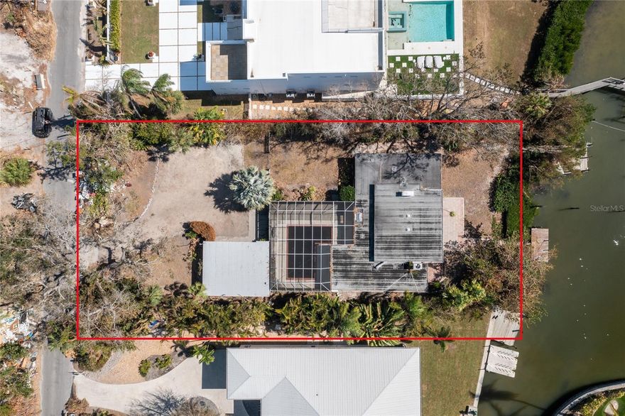This stunning waterfront property on Roberts Point Road in Siesta Key is a rare opportunity for avid boaters and waterfront enthusiasts to build their dream home. The existing house is a tear-down, allowing you to start fresh on an expansive lot of over half an acre, with direct access to Sarasota Bay and quick entry to Big Pass and the Gulf of Mexico. Located in one of the most desirable areas for boating, the property offers breathtaking views and ample space to create a custom home with the potential for a pool and outdoor entertainment area. Embrace the ultimate in coastal living and design a private retreat in this idyllic Siesta Key location.