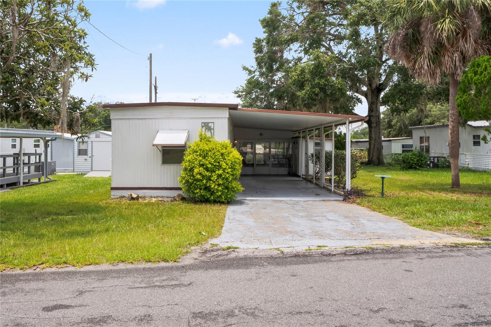 One or more photo(s) has been virtually staged. Charming Updated Home in Leesburg – Ideal for Investors or First-Time Buyers!
Welcome to your next smart investment or the perfect place to call home! You own the property and the land! This beautifully updated 2-bedroom, 1-bathroom gem in Leesburg, FL offers style, comfort, and convenience all in one.
Step inside to discover a freshly renovated interior featuring soft gray kitchen cabinetry, wood-effect countertops, and easy-care vinyl laminate flooring throughout. The modern upgrades continue with a new water heater, ensuring peace of mind for years to come.
Enjoy Florida living year-round on the spacious covered lanai, ideal for relaxing or entertaining guests. The expansive carport easily accommodates two vehicles, offering practical functionality with the addition of the Utility Shed that houses your Washer & Dryer, and has space for your tools and gardening items!
Situated just off US-27, you're perfectly positioned for easy access to Leesburg, Clermont, and major attractions like Disney, Universal Studios, and all that Orlando has to offer — all within a comfortable 56-minute drive. Everyday essentials including healthcare, shopping, and dining are right at your fingertips.
Whether you're an investor looking to expand your short-term rental portfolio, or a buyer searching for an affordable first home, this property is packed with potential and ready to for you to put your own style and make it your place to call home.
Don’t miss out on this opportunity – schedule your showing today!