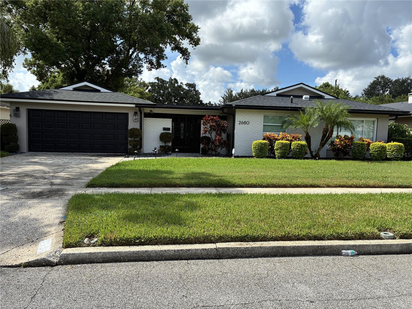 Beautifully remodeled and ideally located, this 4-bedroom, 3-bathroom home in Winter Park Pines offers the perfect blend of comfort, style, and convenience. Situated on a quiet, tree-lined street, the home welcomes you with spacious living areas, including a separate family room and living room—perfect for entertaining or relaxing. The heart of the home is the expansive kitchen, boasting brand-new cabinetry, sleek granite countertops, and stainless steel appliances. Throughout the home, elegant Travertine tile flooring adds warmth and sophistication. An inside laundry room adds everyday functionality. Enjoy the best of Winter Park living with close proximity to the Winter Park Pines Golf Course, scenic Cady Way Trail, and top-rated Winter Park schools. Nestled in one of the area's most desirable neighborhoods, this home offers the rare combination of peaceful surroundings and prime location.