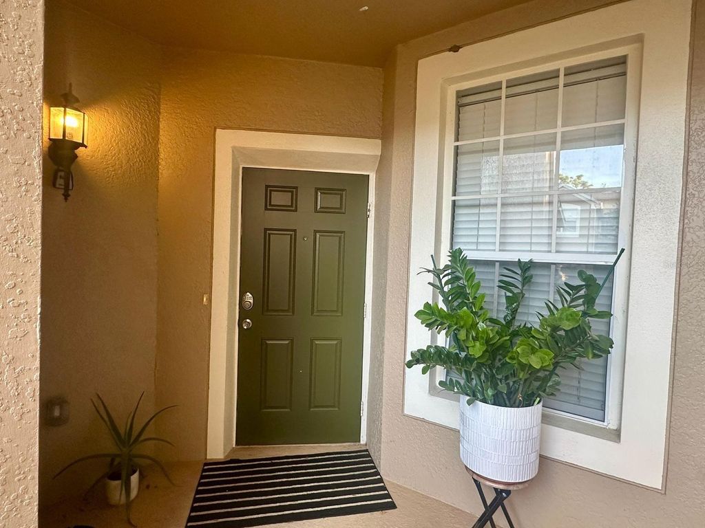 Photo of 6440 Axeitos Terrace #106, Orlando, FL 32835 (MLS # S5142287)