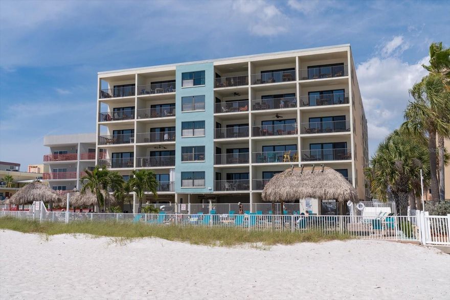 CONSISTENT INCOME producing unit with a three-day minimum at beach front Sandy Shores.  Two hurricane rated sliding glass doors open to a lovely balcony for a peekaboo beach view and a direct view of the Madeira Beach-Treasure Island drawbridge opening upon the ship’s request from the balcony, living room and kitchen table. Never a dull moment being directly across the street from the renowned John’s Pass Village and Boardwalk with waterfront dining, shopping and boating.  For more than 40 years, the historic John's Pass Village & Boardwalk has been transformed into a venue for the John's Pass Seafood Festival, a wildly popular celebration of fresh Gulf seafood, currently held every fall.  Year round the unit is open, light and bright with updated appliances and ceramic tile flooring throughout.  Oversized master bedroom ensuite complete with a spacious walk-in closet.  Sold fully furnished right down to the housewares.  White plantation shutters cover the master bedroom windows and sliding glass doors to add enhanced privacy as well as additional light and sunlight barriers.  Of Sandy Shores 55 units every balcony has been structurally inspected and repaired to pass Milestone Report.  The complex boasts a new roof, fresh paint, repaved parking area and a new building generator.  The extremely popular short-term rental complex is on 130 feet of private gulf frontage. Sandy Shores provides a beautiful resurfaced, heated beach front pool with remodeled pool bath, both secured by a new vinyl fence with tiki huts, grill station, picnic tables and colored lighting in the pool area.  The seller states it best, "The only thing separating you from the beach is the pool!"