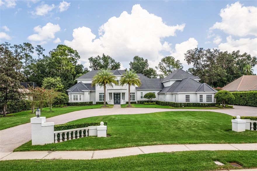 This beautiful, fully renovated, turn key home is located in the premier guard gated community of Heathrow Woods and situated on a gorgeous 1 acre lot with breath taking water views,