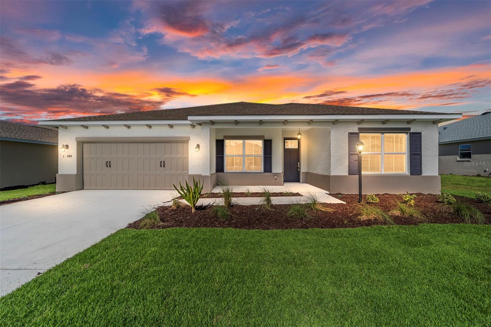 Discover the Ariana Model, a stunning new construction home in LongLeaf Ridge at On Top of the World, Ocala’s premier 55+ active adult community. Thoughtfully designed for both style and comfort, this home offers 2 bedrooms, 2 bathrooms, a versatile flex room, tile flooring throughout, and a spacious 2+ car garage. The gourmet kitchen is a showstopper, featuring stainless steel appliances, dark staggered cabinetry with crown molding, quartz countertops, elegant backsplash, and under-cabinet lighting. A walk-in pantry and oversized island provide ample storage and functionality—perfect for entertaining or everyday living. The flex room at the front of the home is ideal for a home office or hobby space. The guest bedroom enjoys abundant natural light and a large closet, with an adjacent full bath featuring a quartz vanity and a tile shower/tub combination. The primary suite is a private retreat with a large three-panel window, generous walk-in closet, and spa-inspired en suite complete with double vanity sinks with quartz counters, a zero-entry tiled shower with built-in bench and glass enclosure, and a linen closet. Step outside through the sliding door to the screened lanai, where you can enjoy Florida living year-round. Nestled in a gated, golf cart-friendly community with world-class amenities and direct access to shopping and dining, this home perfectly balances luxury and convenience. Don’t miss your chance to own this elegantly finished, move-in ready home—schedule your private showing today!