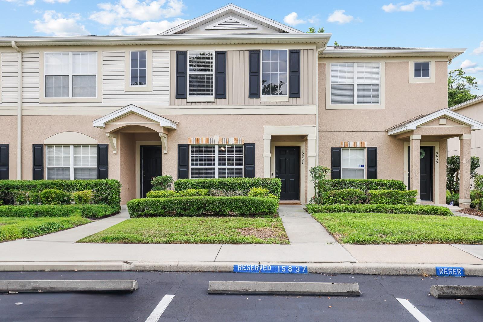 One or more photo(s) has been virtually staged. Welcome to this charming 2-bedroom, 2.5-bathroom townhome nestled within the gated community of Fishhawk Ridge, part of the highly sought-after master community of Fishhawk Ranch. Offering 1,383 square feet of inviting living space, this home welcomes you with a bright foyer and a formal dining room accentuated by a large picture window. A discreet half bath is conveniently located off the hallway. The main living areas feature rich hand-scraped wood flooring, while the kitchen and bathrooms are tastefully appointed with ceramic tile. The kitchen is a standout with crisp white cabinetry, stainless steel appliances, and two generous pantry closets, seamlessly flowing into the family room at the rear of the home, which opens to a patio with tranquil conservation views. Hardwood-finished stairs lead to the second floor, where both bedrooms are comfortably carpeted and equipped with ceiling fans. Each bedroom includes an en-suite bathroom and dual closets, with the primary bedroom featuring spacious walk-in closets. Enjoy access to Fishhawk Ranch’s incredible amenities, including tennis courts, resort-style pools, fitness centers, more than 30 miles of scenic trails, and top-rated "A" schools.